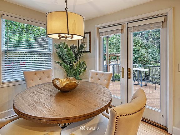 Dining Area with French Doors to Backyard Oasis 