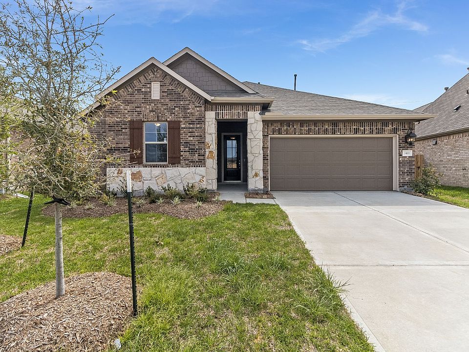 Welcome home to 3411 Acacia Grove Lane located in the Meadows at Imperial Oaks and zoned to Conroe I