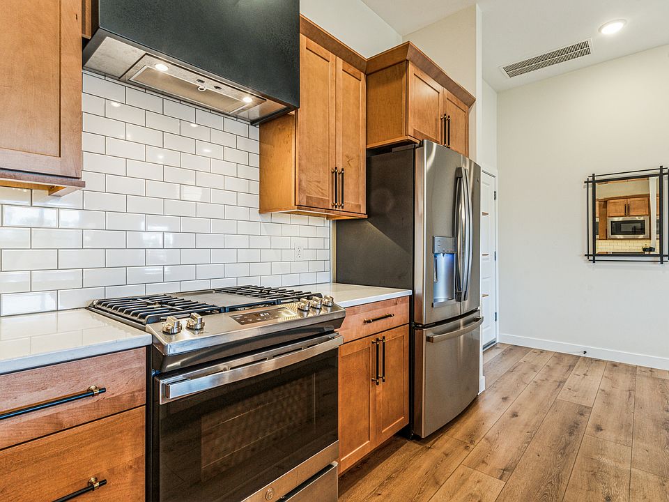 Plentiful cabinet storage with state-of-the art appliances and upgraded kitchen hood