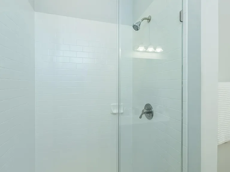 ELEGANT GLASS PANEL SHOWER WITH SUBWAY TILE