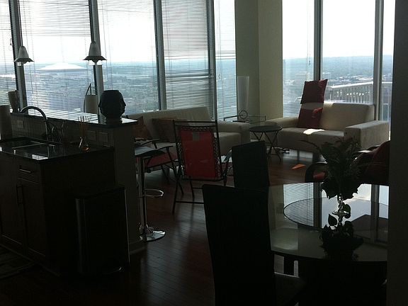 good sized living room with round dining table