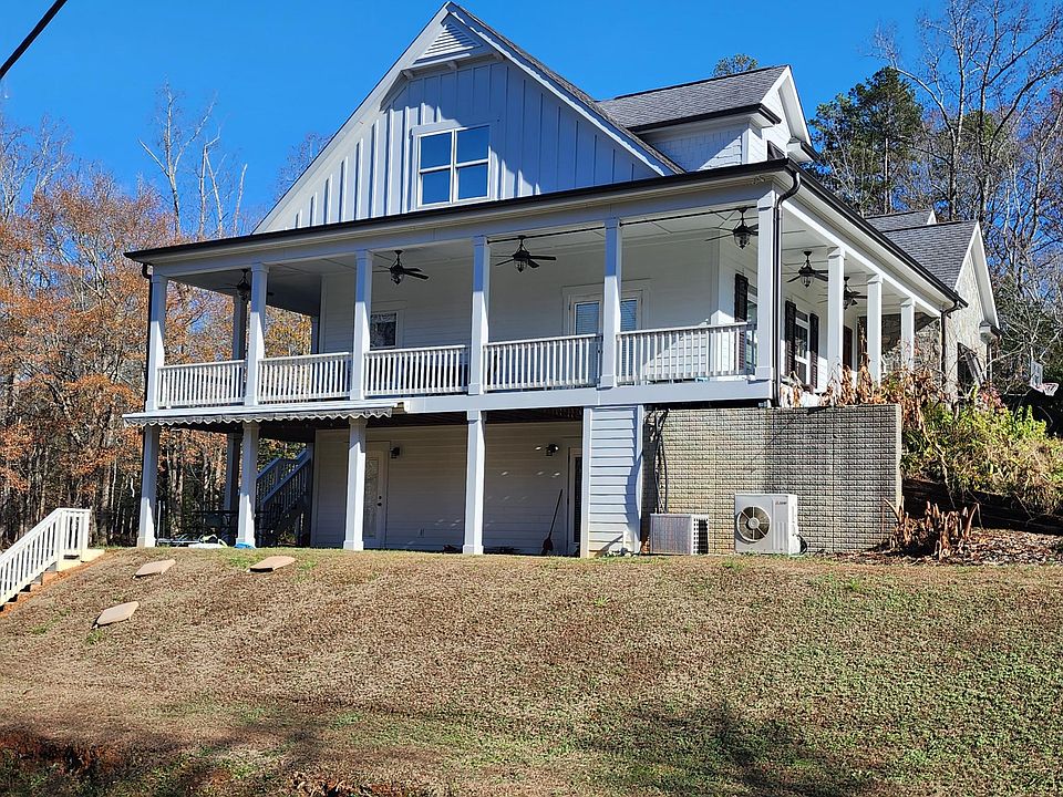 Walk around porch and view of primary bedroom window.