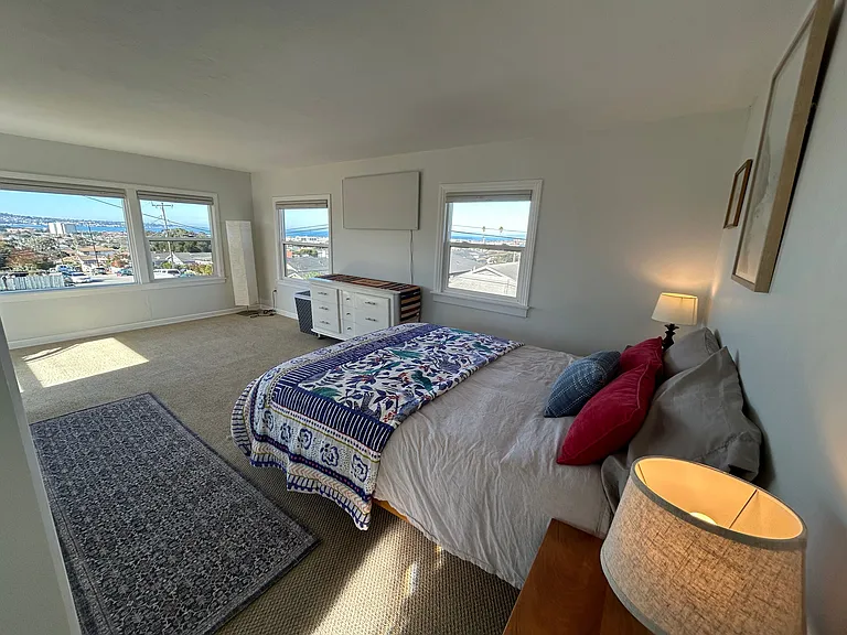 upstairs bedroom bed and view