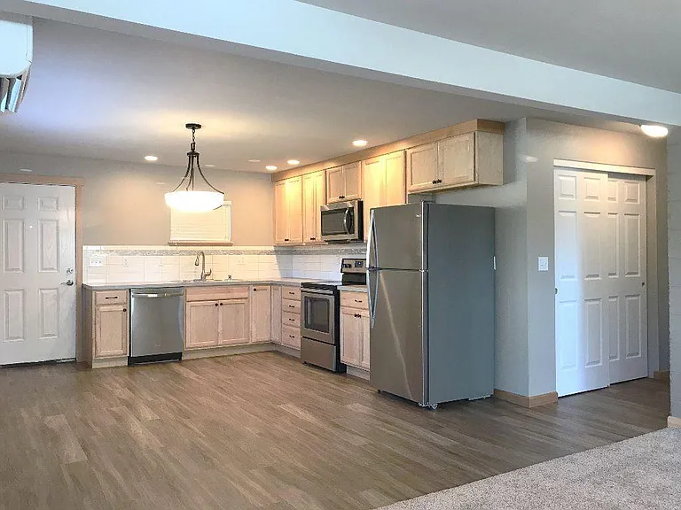 Generous eat in kitchen with a huge pantry around the corner.