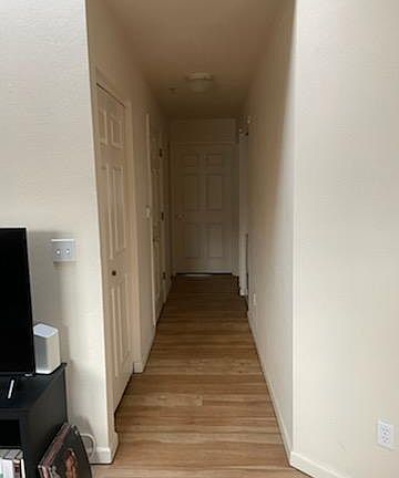Hallway to bedrooms, washer-dryer and bathroom