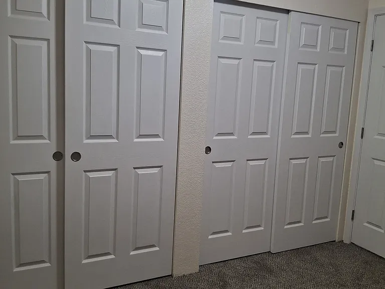Primary bedroom has double closets