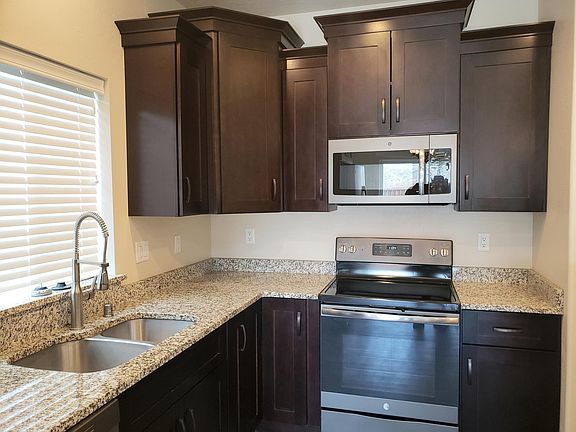 Double stainless steel sinks. Dishwasher, Electric cooking.