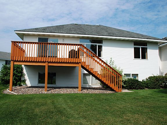 Spacious deck viewing scenic backyard