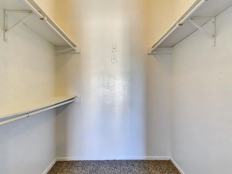 Enjoy ample storage with this oversized walk-in closet_ideal for organizing clothes, shoes, and accessories.