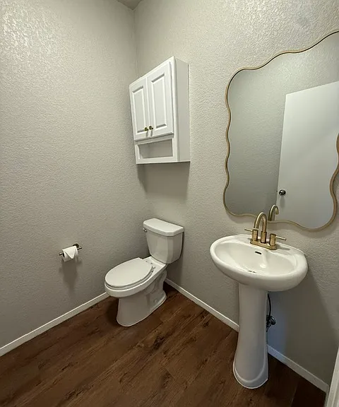 Super cute powder room for your guests on the first level.