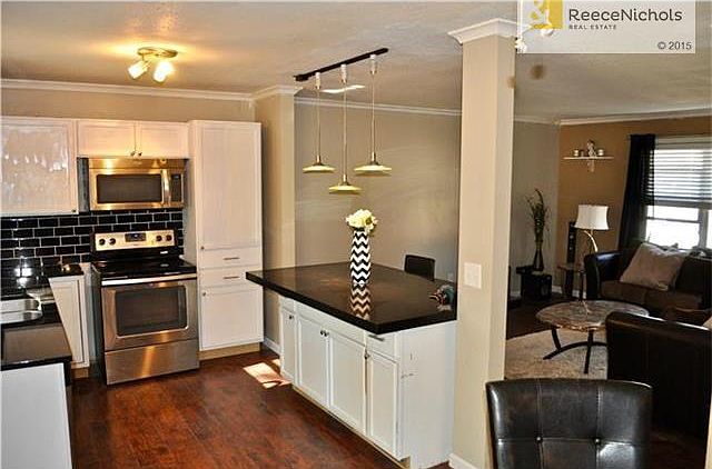 Open concept kitchen with huge Granite island seats up to 6 people.