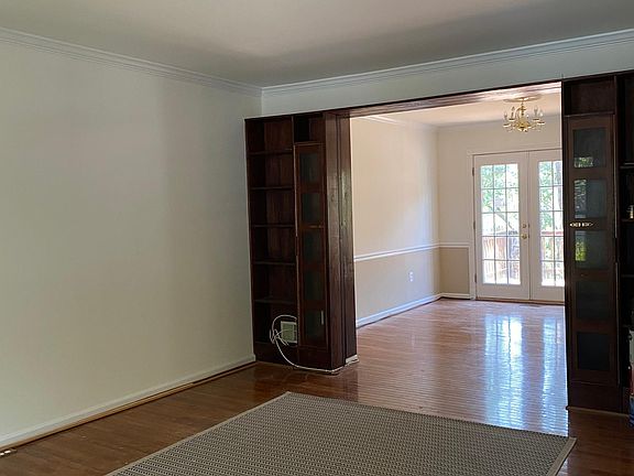 living room with built-in bookshelves