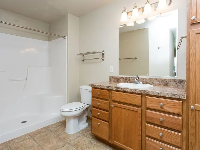 Step into comfort at Northdale Apartments, where modern design meets functionality. This beautifully appointed bathroom features elegant finishes and ample lighting. Elevate your lifestyle todayschedule a tour and see it for yourself!