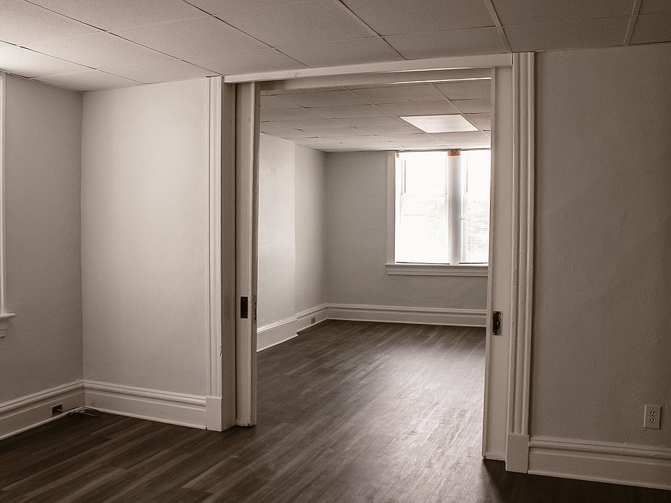 Bedroom looking through the pocket doors into the living room.