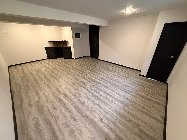 giant 4th bedroom in basement with new LVP flooring