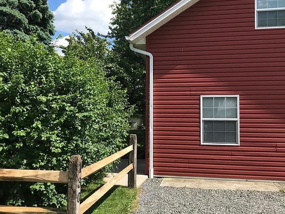 Front of apartment with off street parking