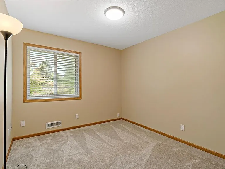 Bedroom #2 with large closet, new carpet, and fresh paint