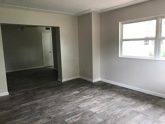 This is the view from the font door of the living room and dining room.