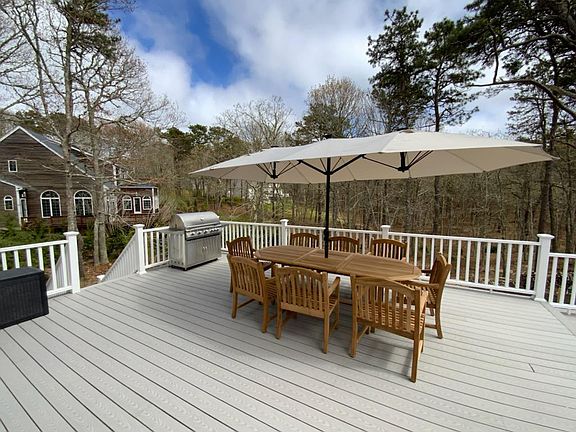 3 tier large deck area with eating, seating, sunning areas and hot tub!