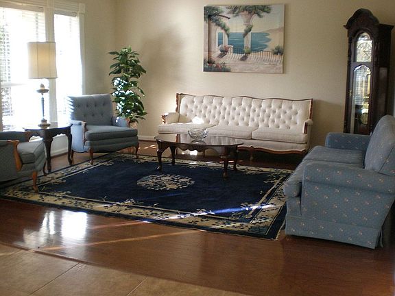 Formal Living Room with crown molding and hardwood floors