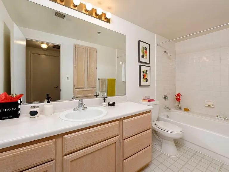 Classic Package I bath with white countertops and oak cabinetry