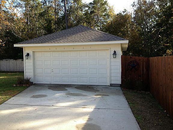 Detached garage with open rafters to create your own storage area.