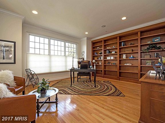 Handsome library anchored by custom bookcases