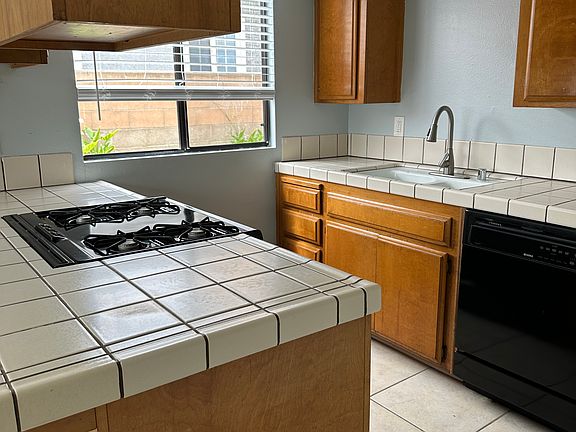 Nice open kitchen!! There is a gas stove, dishwasher, and lots of natural light with oversized windows throughout!