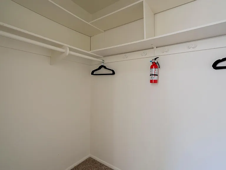 Primary Walk-In Closet with Dual Sides
