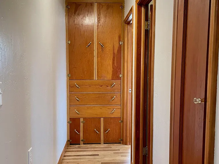 Hallway with classic linen closet