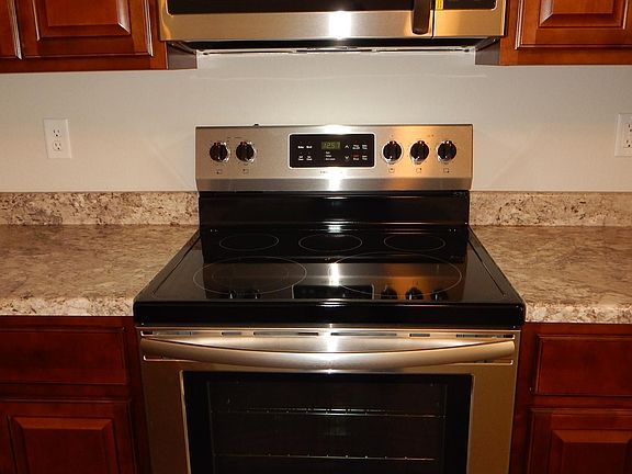 Smooth top stove and microwave/vent hood.