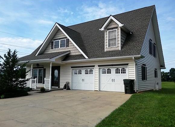 SITS ON 66 ACRE CORNER LOT