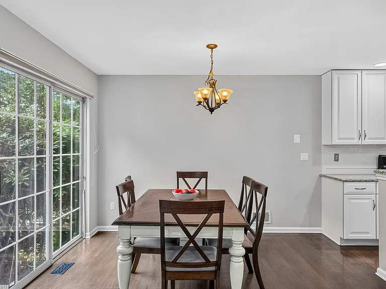 Eat in Kitchen Dining Area with Sliding Glass Doors leading to Private Patio