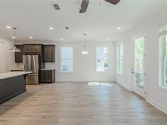 Lots of natural light on the main floor Photos NOT OF ACTUAL HOME but of PREVIOUSLY BUILT HOME P
