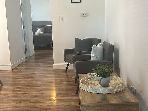 Inviting living room with comfy chairs, decorative cushions and elegant decor.