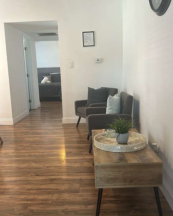 Inviting living room with comfy chairs, decorative cushions and elegant decor.