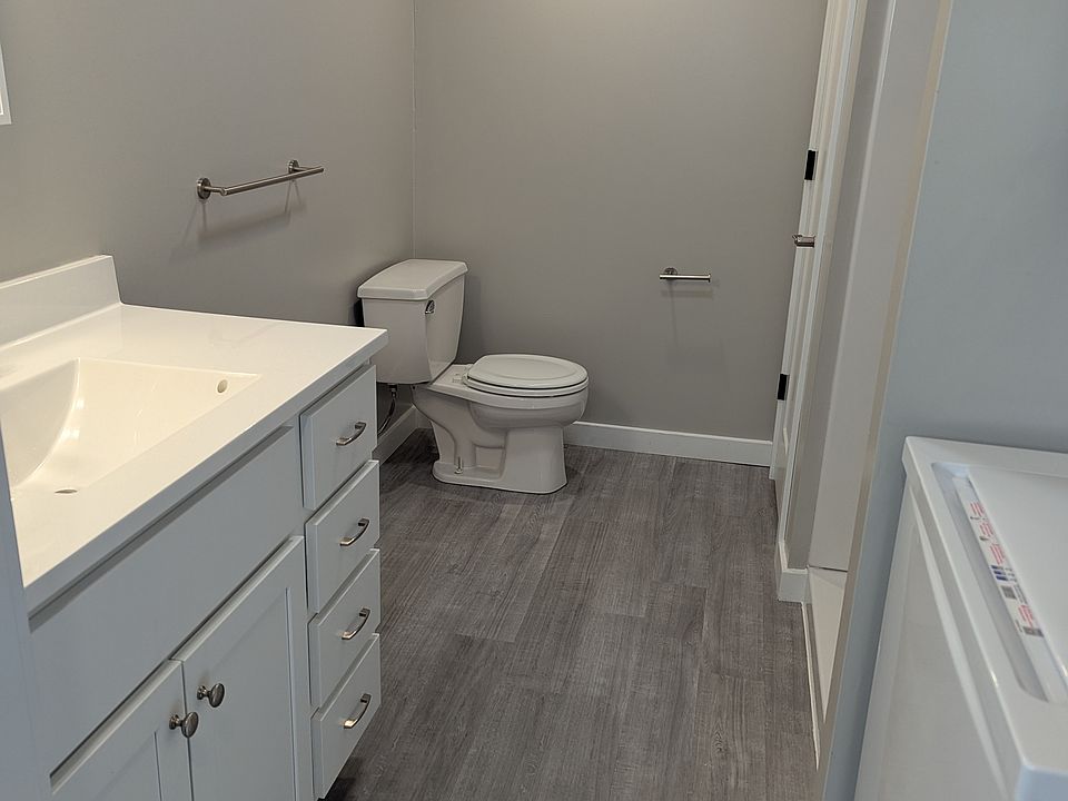 Large vanity, linen closet
Shower and washer and dryer