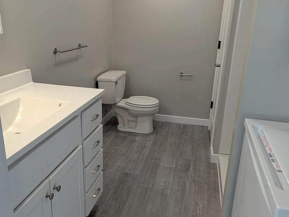 Large vanity, linen closet
Shower and washer and dryer