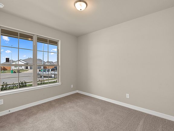 The fifth bedroom is perfect for an in-law suite and features a private bath.