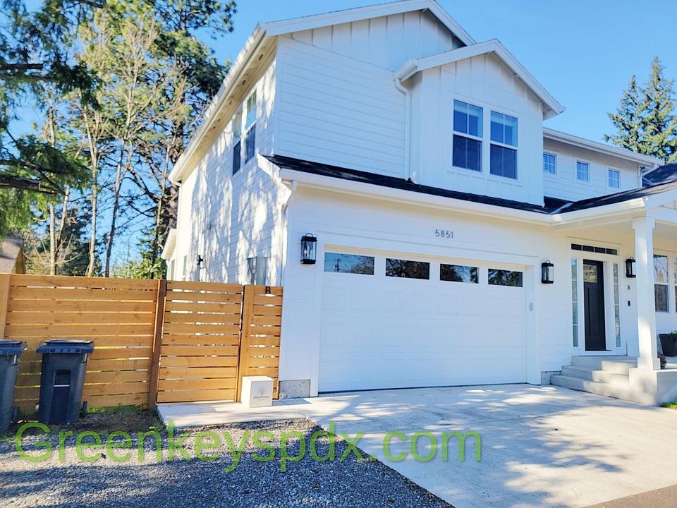 Front exterior - enter through gate to left of garage