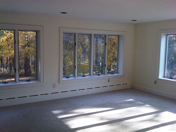 Family Room off of kitchen overlooking gorgeous, private backyard