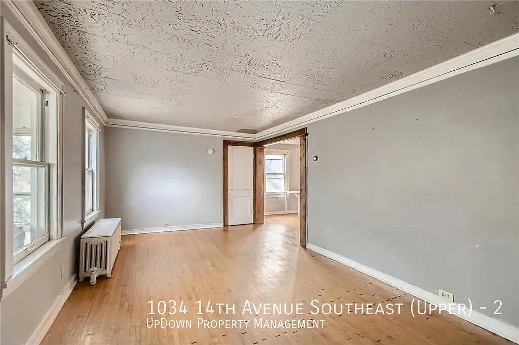 "Charming 2-Bed Upper Unit with Gleaming Hardwood Floors in Vibrant SE Como Neighborhood!" — Photo 3