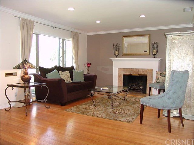 Spacious living room with picture window and gas fireplace