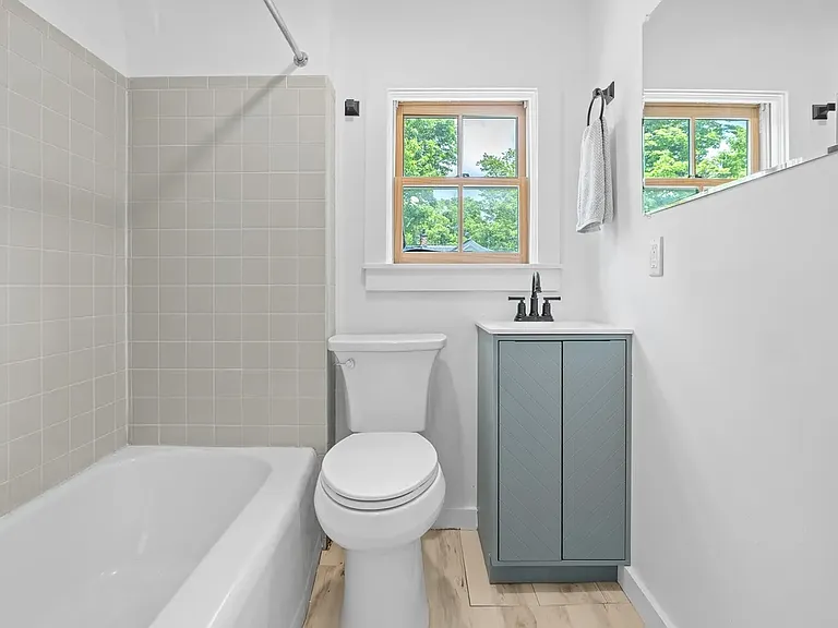 Bathroom - Second Floor. The Small bathroom has a bath fan that runs when the light is on to prevent moisture issues. It's a Panasonic that is whisper quiet and efficient.