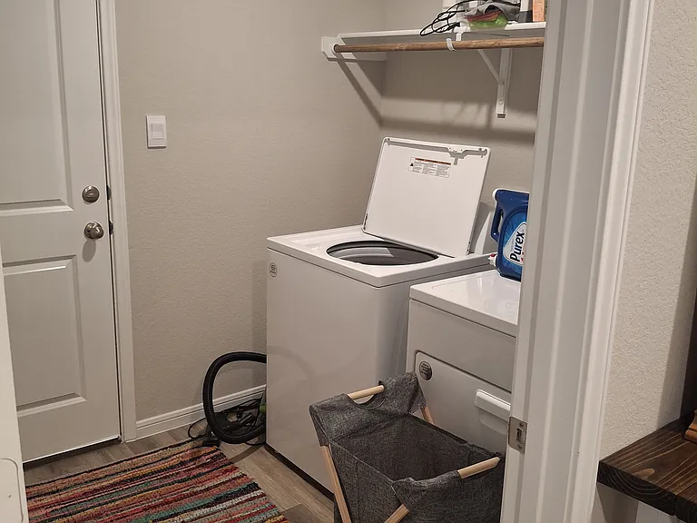 Washroom is in room between garage and main area. Not near kitchen or bathroom.
