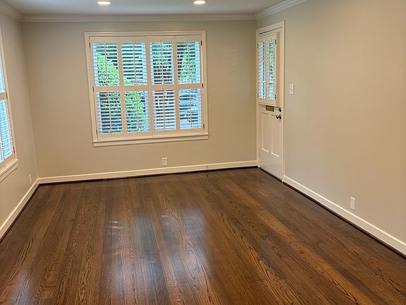 Main living area freshly painted with refinished hardwood floors