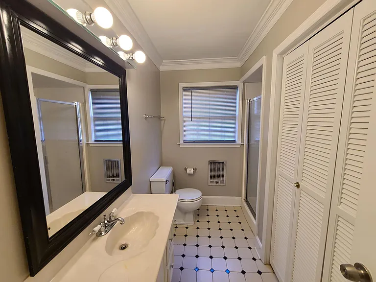 The downstairs bedroom also has a full bath and closet en suite.