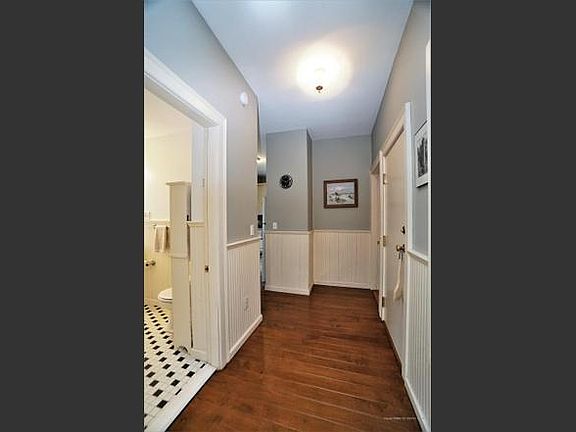 Hallway leading from dining room to bathroom and kitchen- looking toward rear of home