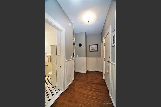 Hallway leading from dining room to bathroom and kitchen- looking toward rear of home