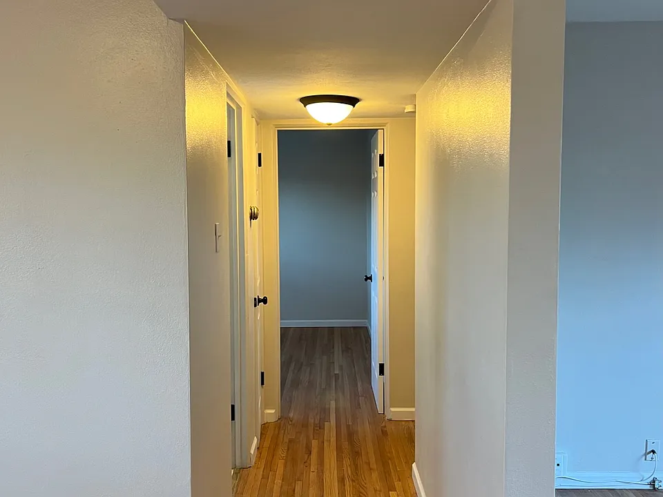 Hallway off the dining room looking down into the bedrooms.
